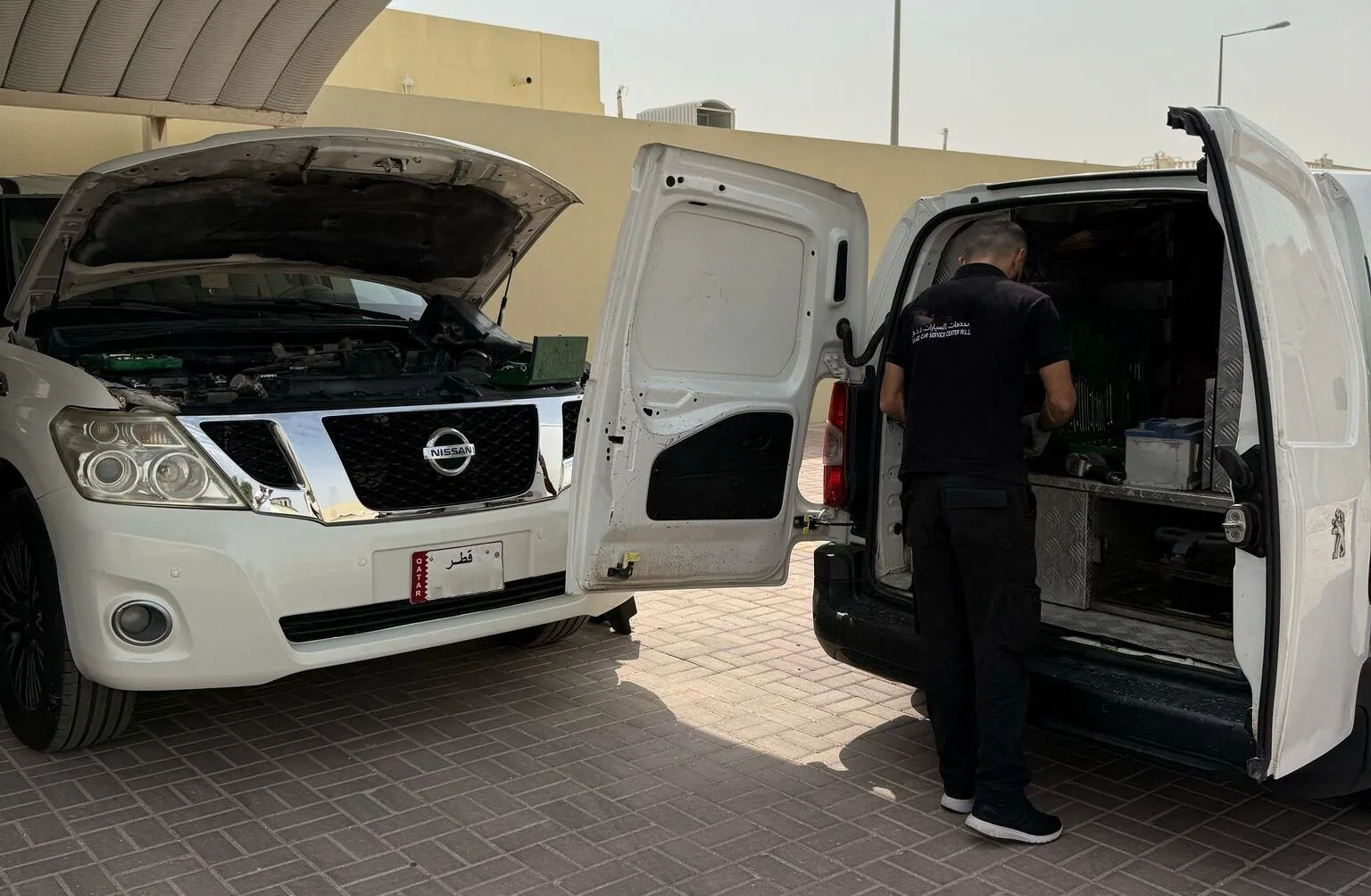 On The Go technician performing Car Battery Change Home Service on-site